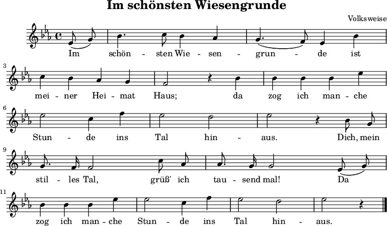 
\language "deutsch"
\header {
   title = "Im schönsten Wiesengrunde"
   composer = "Volksweise"
tagline = ##f
}
\score {
   <<
   \chords {
   
   }
   \relative c' {
      \key es \major
      \time 4/4 \partial 4
      \autoBeamOff

    es8( g) b4. c8 b4 as g4. (f8) es4 b' \break
	c b as g f2 r4 b b b b es \break
	es2 c4 f es2 d es r4 b8 g \break
	g8. f16 f2 c'8 as as8. g16 g2 es8( g) \break
	b4 b b es es2 c4 f es2 d es r4 \bar "|."
   }
   \addlyrics {
    Im schön -- sten Wie -- sen -- grun -- de ist mei -- ner Hei -- mat Haus;
	da zog ich man -- che Stun -- de ins Tal hin -- aus. Dich, mein stil -- les Tal,
	grüß' ich tau -- send mal! Da zog ich man -- che Stun -- de ins Tal hin -- aus.  
   }
   >>
   \layout { indent = 10\mm }
   \midi {}
}
