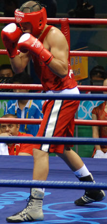 photograph of Said Rachidi boxing in the ring at the Olympics