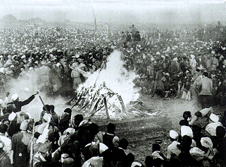 Cremation of Mahatma Gandhi at Rajghat, 31 January 1948. It was attended by Jawaharlal Nehru, Lord and Lady Mountbatten, Maulana Azad, Rajkumari Amrit Kaur, Sarojini Naidu and other national leaders. His son Devdas Gandhi lit the pyre.[118]