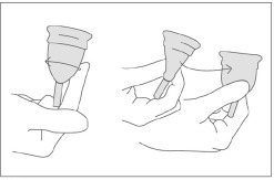 Running an index finger around the middle of the body of the cup; pinching the bottom and then twisting the cup.