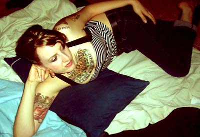 Me Laying down, I have a lotta tattoos :)