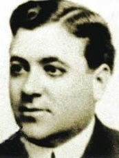 Black and white photo of a man in a suit and tie