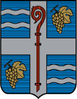 Armoiries de la Ville de LAGRAVE - Blason : D'azur à la croix d'argent, chargée d'une crosse de gueules, cantonnée au premier et au quatrième de deux fasces ondulées