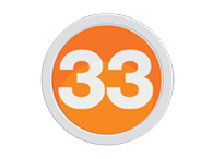A silver 33 in a sans serif on an orange circle trimmed in silver
