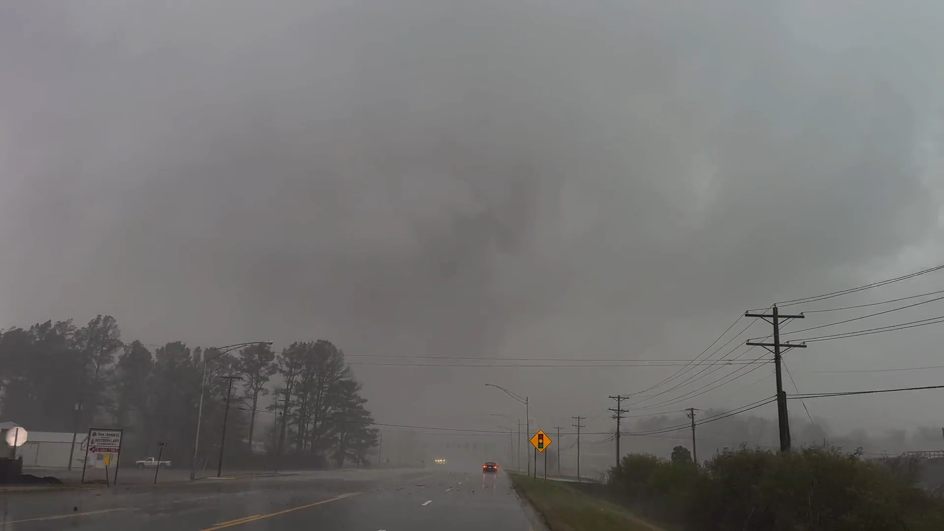 The large, rain wrapped EF3 Wynne tornado as it is seen moving through Wynne, Arkansas.