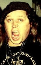 Kinison with his mouth agape