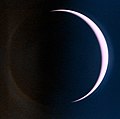 An image of Venus with a crescent shaped area that is illuminated by sunlight. The image was taken with UVI.