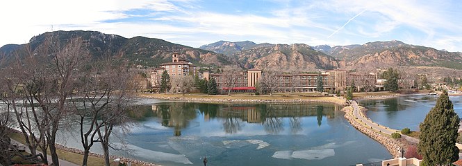 The Broadmoor resort, with Cheyenne Lake in the foreground and Cheyenne Mountain in the left half of the background