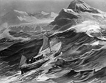 A small boat with two sails set climbs the steep side of a wave. In the background are the rocky tops of high cliffs and distant mountains