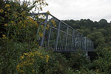 Older-style bridge from the shore.