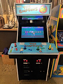 A blue arcade game with The Simpsons characters on it