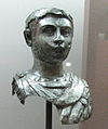 Unknown young man head wearing a scale breastplate