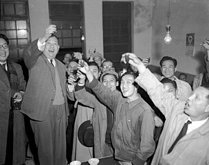Wu San-lien (second left) celebrates with supporters after being elected Mayor of Taipei.