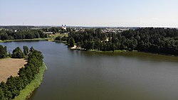 Sumowo Bakałarzewskie Lake with the Saint James church in the background