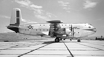 A large four engined aircraft sitting at an airfield