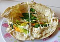 A quesadilla with queso Oaxaca, flor de calabaza, and epazote