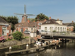 Flour mill Eben Haëzer in street view of Enumatil