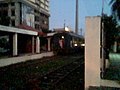 Exterior of Buendia railway station (prior to renovation) with a departing Commex train