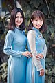 Two women wearing blue áo dài, February 2017