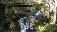 Lower cascade - view looking under hiking trail foot bridge