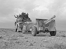 Photograph of a field gun and an artillery tractor