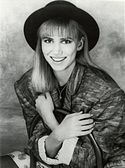 Debbie Gibson smiling towards the camera.