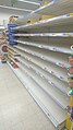 Empty shelves of canned meat and other food in Tesco, Prague, on 27 February 2020