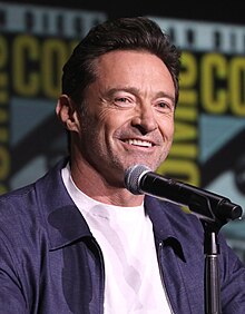 Jackman looking toward a camera