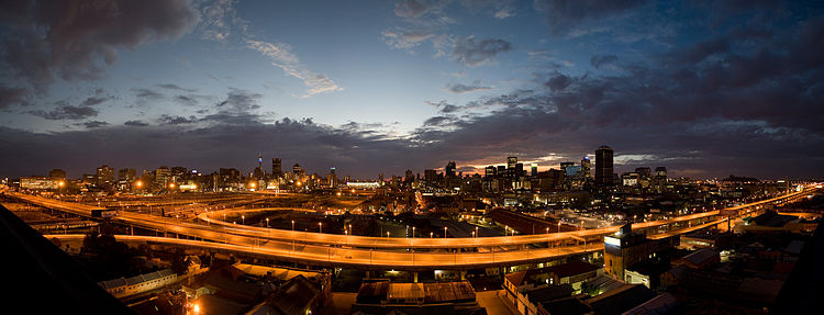 A panorama of the Johannesburg CBD at sunrise looking east across the M1 highway.