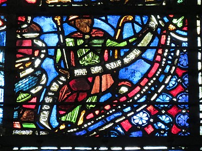 Window of Saint Joseph, Bay 9. (13th c.) The glass is signed by the artist on the band in front of the Saint: "Clement- glassmaker of Chartres"