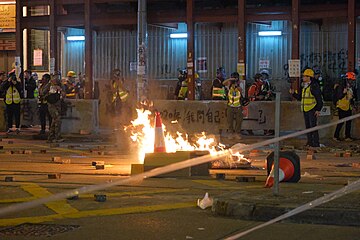 A makeshift roadblock set on fire