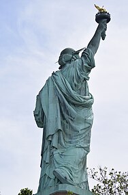 Statue of Liberty, 1886, copper on iron framework. Viewed from behind, showing the statue's contrapposto pose