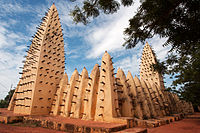 A mosque with sticks poking out of it