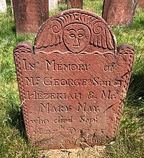 A marker dated 1775 carved by Peter Buckland of Manchester, made of brick red brownstone from the Buckland Quarry in Manchester.