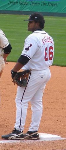 A baseball player in white