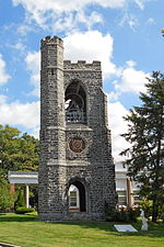 The 1886 Gothic Revival Bell Tower designed by Cope and Stewardson sits at the highest elevation in West Laurel Hill Cemetery