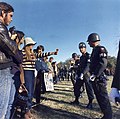 Image 73A demonstrator offers a flower to military police at a National Mobilization Committee to End the War in Vietnam-sponsored protest in Arlington, Virginia, on October 21, 1967. (from Nonviolent resistance)