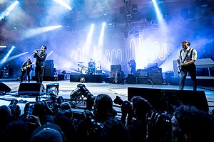 Arctic Monkeys performing at the Roskilde Festival in 2014. From left to right: Nick O'Malley, Alex Turner, Matt Helders and Jamie Cook