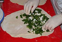 A simple example of a popular preparation of gözleme with spinach, parsley, and Turkish white cheese.