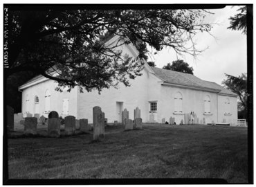 A July 1999 black and white photo of the church