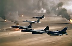 USAF aircraft of the 4th Fighter Wing fly over Kuwaiti oil fires, set by the retreating Iraqi army during Operation Desert Storm in 1991.
