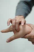 Acupressure being applied to a hand