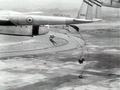 French Union paratroopers dropping from a "Flying Boxcar".