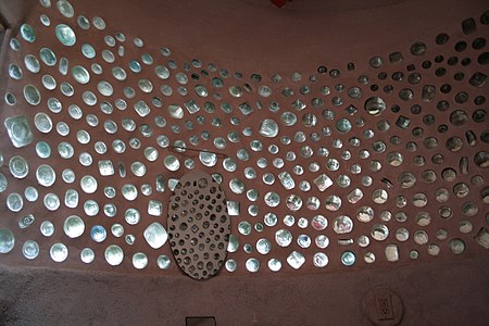 An interior of a bottle wall bathroom