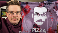 John Green with a "Pizza John" shirt