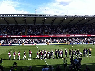 West Ham and Millwall players shake hands before kick-off at The Den on 17 September 2011.[82]