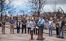 President Joe Biden delivers remarks at Lahaina Banyan Tree Park after surveying damage from deadly wildfires on the island of Maui, Monday, August 21, 2023, in Hawaii. In attendance, from left, are FEMA Administrator Deanne Criswell, Rep. Ed Case (D-HI), Lieutenant Governor Sylvia Luke, Maui County Mayor Richard Bissen, Rep. Jill Tokuda (D-HI), Senator Mazie Hirono (D-HI), Senator Brian Schatz (D-HI), First Lady Jill Biden, Mrs. Jaime Green and Hawaii Gov. Josh Green.