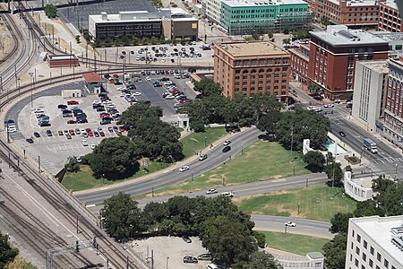 Dealey Plaza (2015) as viewed from Reunion Tower. Shown are the Texas School Book Depository and the "grassy knoll" in the upper center, the seven-story Dal-Tex Building, and the Dallas County Records Building.