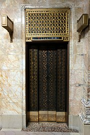 Photograph showing an ornately detailed elevator door