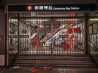 Protesters plastered the gate of Causeway Bay station with anti-CCP placards.